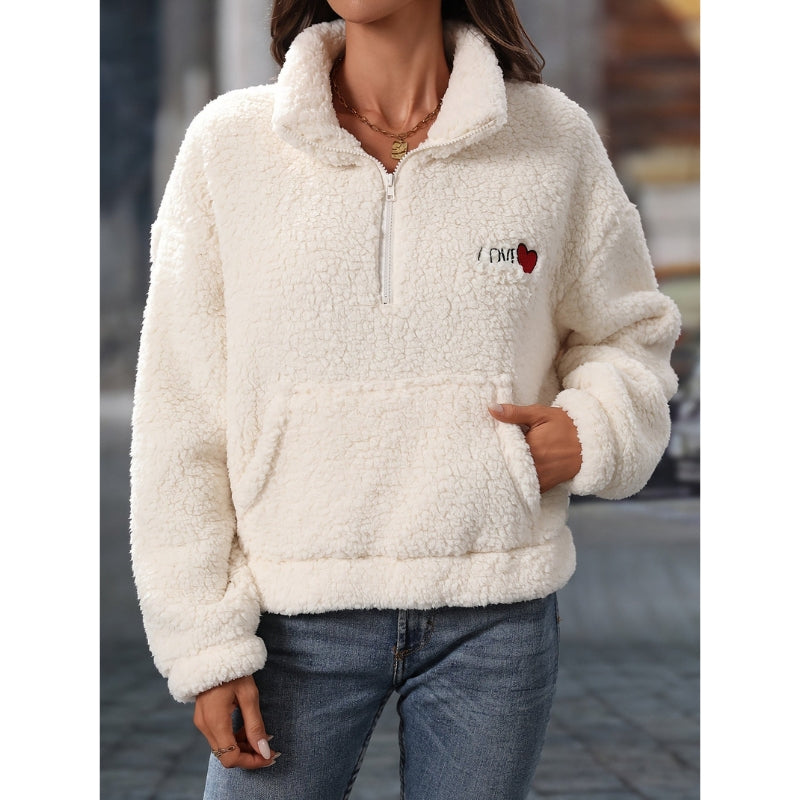 Amaya – Elegant pullover med halv lynlås, lange ærmer og forlomme