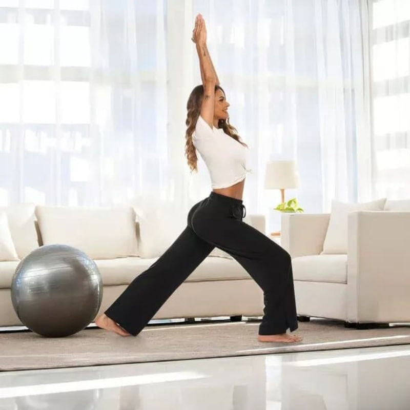 Monica – Højtaljede yogabukser med vide ben og lommedetaljer