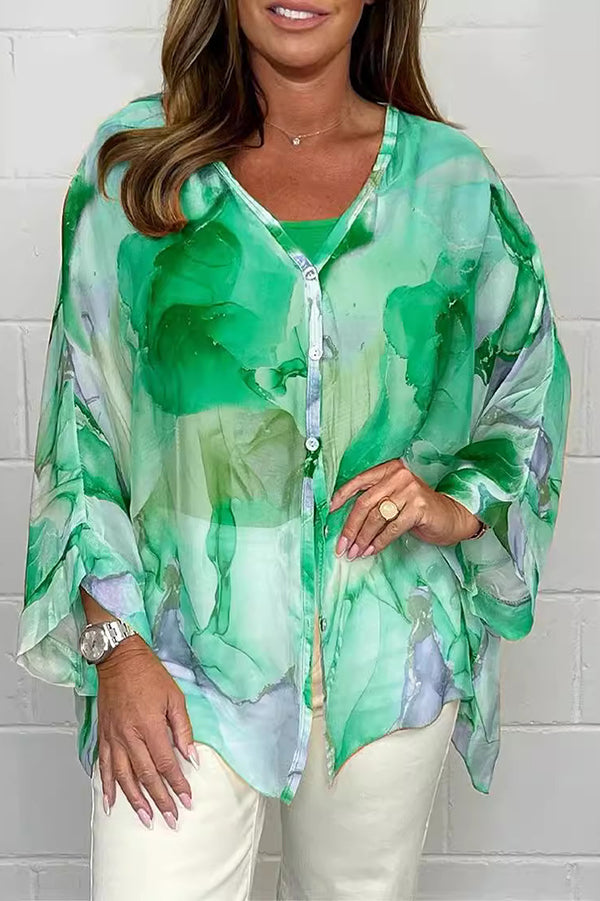 Seraphina – Stilfuld langærmet bluse med blomsterprint og knaplukning