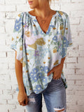 Tracy – Elegante bluse med blomstertryk med V udskæring og korte flydende ærmer