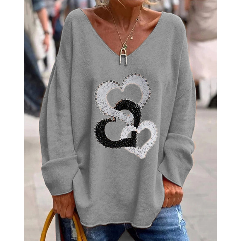 Mirella – Trendy oversized sweater med V-hals, hjerteprint og afslappet pasform