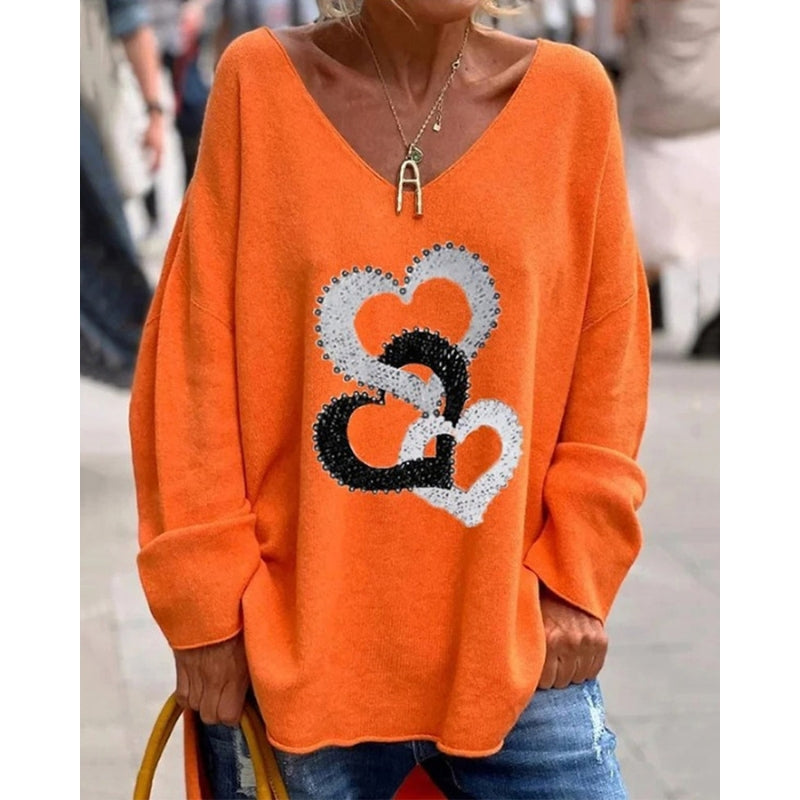 Mirella – Trendy oversized sweater med V-hals, hjerteprint og afslappet pasform