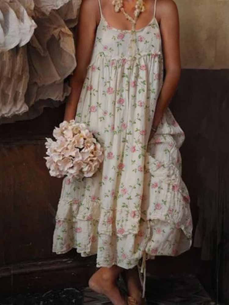 Josefine – Stilfuld ærmeløs maxikjole med blomsterprint og spaghettistropper