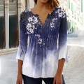 Olivia - Moderne bluse med blomsterprint og knapdetaljer