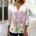 Olivia - Moderne bluse med blomsterprint og knapdetaljer