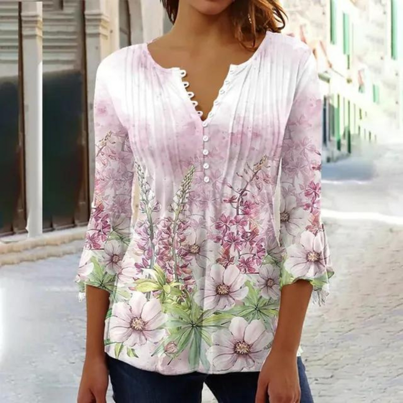 Olivia - Moderne bluse med blomsterprint og knapdetaljer