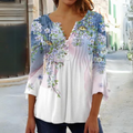 Olivia - Moderne bluse med blomsterprint og knapdetaljer