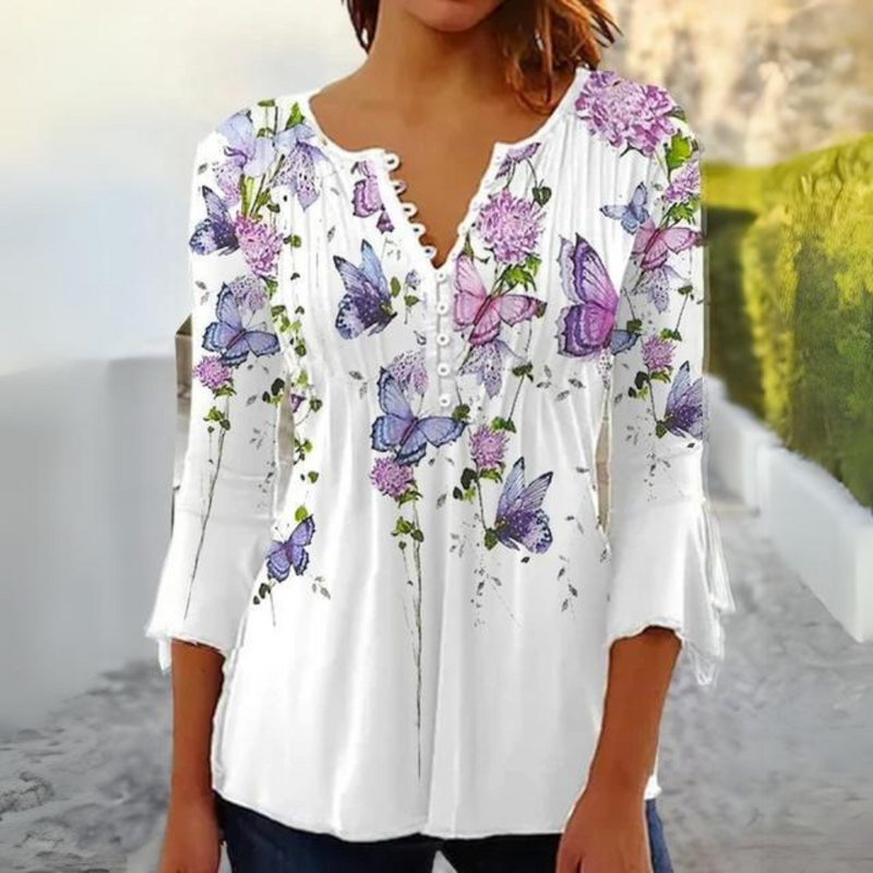 Olivia - Moderne bluse med blomsterprint og knapdetaljer