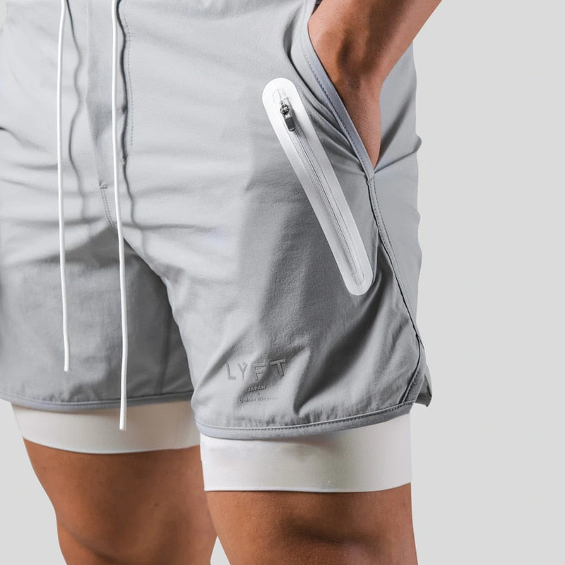 Jaxon – 2 i 1 sportsshorts med lynlåslommer og snøre i taljen