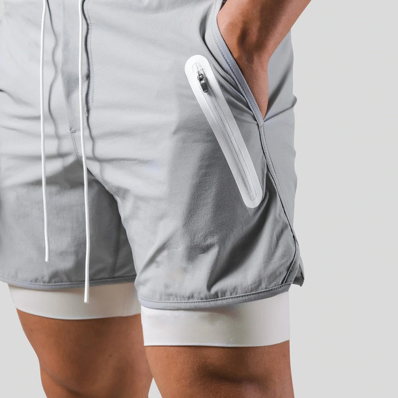 Jaxon – 2 i 1 sportsshorts med lynlåslommer og snøre i taljen
