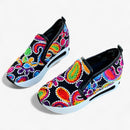 Amanda – Slip on sneakers med kileformet sål og blomsterbroderidetaljer