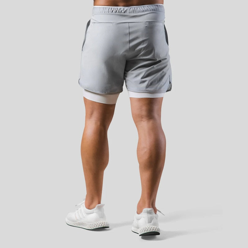 Jaxon – 2 i 1 sportsshorts med lynlåslommer og snøre i taljen