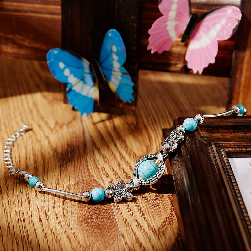 Maria – Moderne armbånd med sommerfuglevedhæng og justerbart design