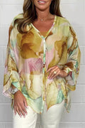 Seraphina – Stilfuld langærmet bluse med blomsterprint og knaplukning