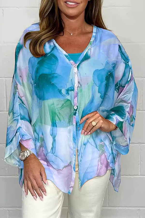 Seraphina – Stilfuld langærmet bluse med blomsterprint og knaplukning