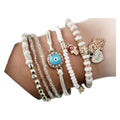 Malinda – Boheme Charm Armbåndssæt med en blanding af perlebesatte armbånd og alsidigt design